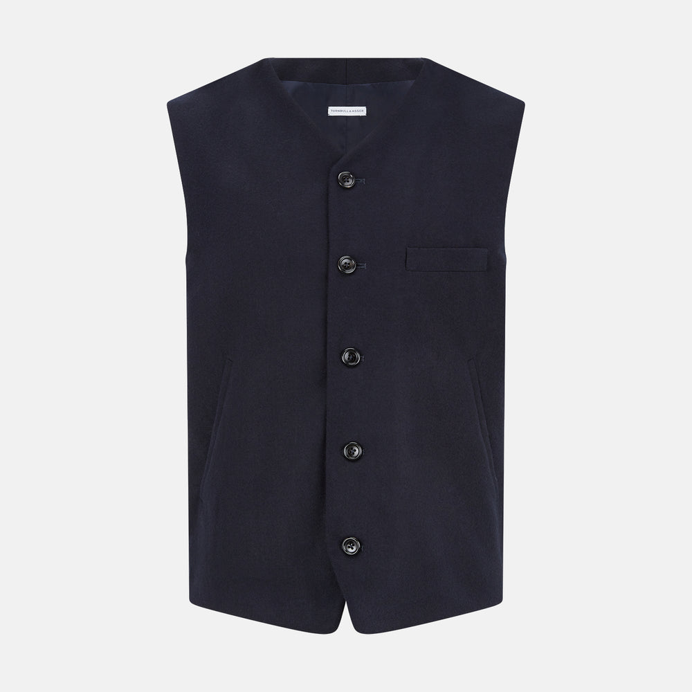 The Turnbull & Asser Navy Single-breasted Waistcoat is a sleeveless wool-cashmere piece with a small chest pocket and two side pockets, shown against a white background—an ideal addition to your winter wardrobe.
