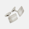 View 1 of product Turnbull & Asser Silver Striped Rectangular Cufflinks feature a subtle horizontal engraved line pattern on the front, set against a white background.