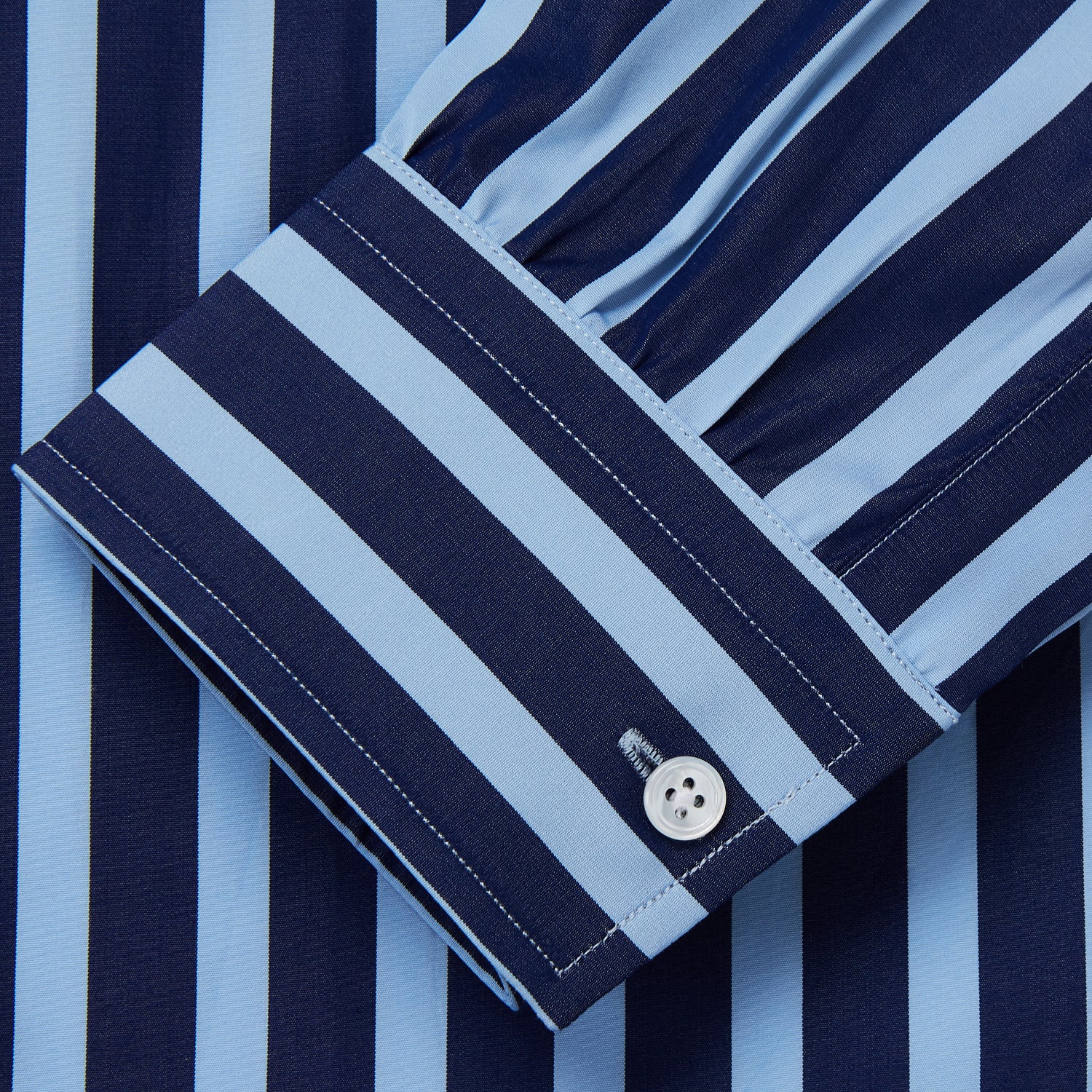 View 2 of product The Turnbull & Asser Navy Multi Stripe Cotton Weekend Fit Suffolk Shirt features vertical blue and navy stripes, a chest pocket, buttoned cuffs, and a classic buttoned Dorset collar.