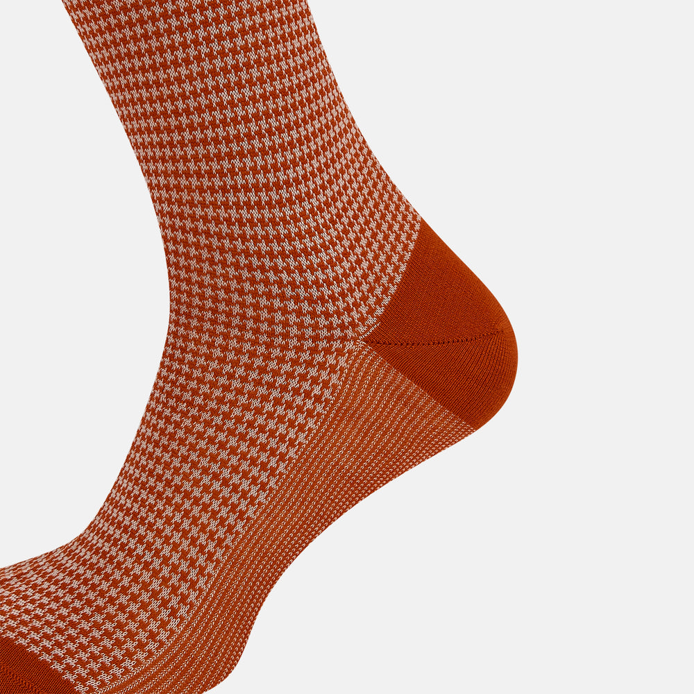 The Rose Houndstooth Mid-Length Sock by Turnbull & Asser, shown in red and white with solid red toe, heel, and cuff, is displayed on a plain white background.