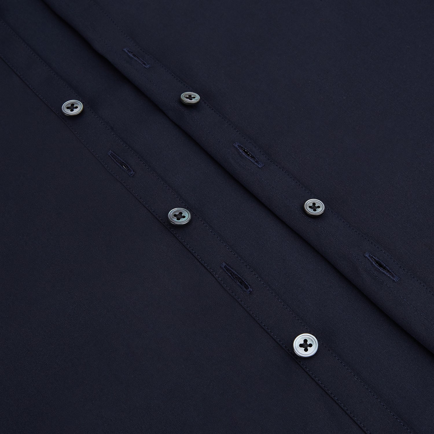 View 7 of product The Navy Westminster Shirt by Turnbull & Asser is a classic long-sleeve, button-up shirt with a pointed collar and buttoned cuffs, exemplifying British craftsmanship, shown against a plain white background.