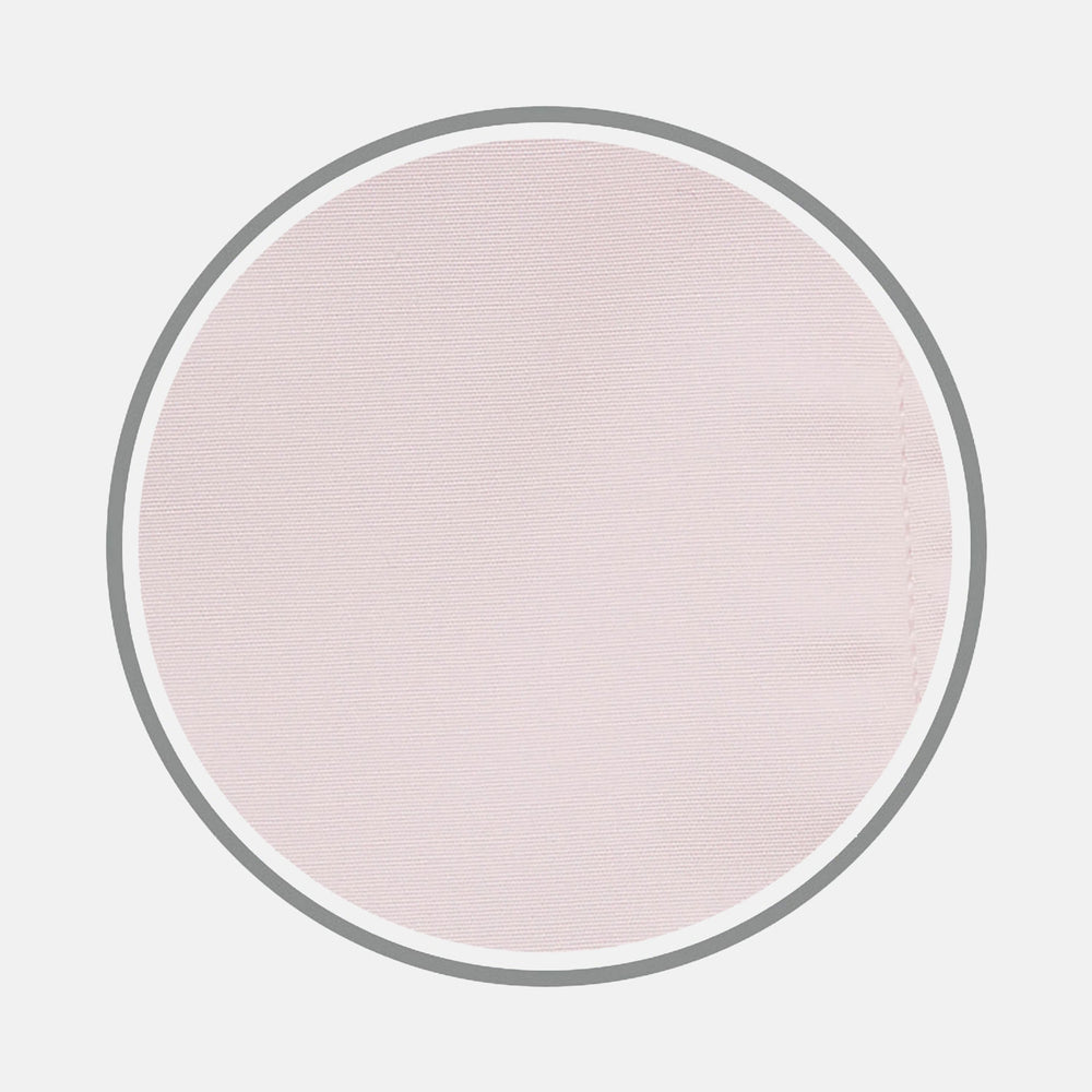 A close-up of Turnbull & Asser's Pink Cotton Fabric shows its fine, smooth texture and subtle stitching inside a circular gray-bordered frame against a white background.