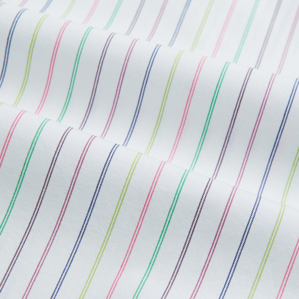 The Turnbull & Asser Multicoloured Double Pinstripe Mayfair Shirt, made from organic cotton, features thin blue, green, and pink stripes on white and is displayed laid flat on a white surface.