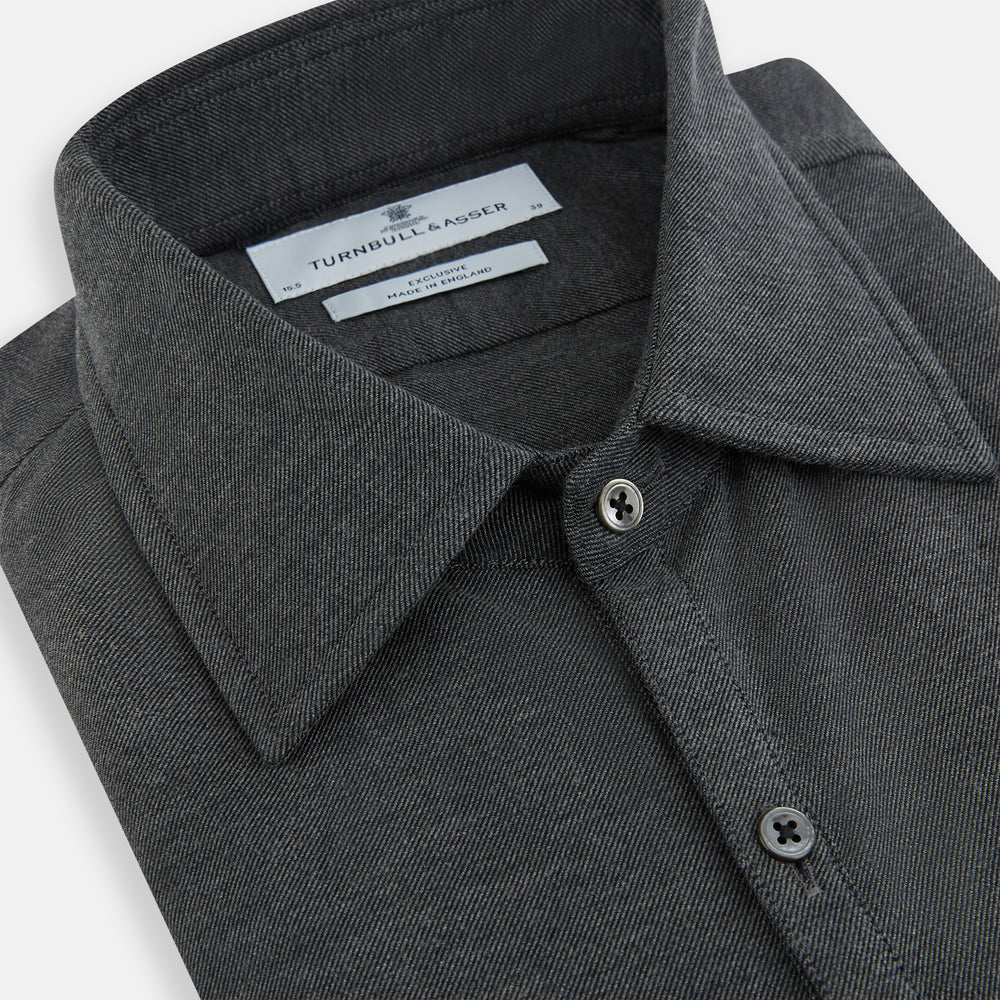 The Charcoal Melange Westminster Shirt by Turnbull & Asser features a long-sleeve, button-up design with a Turnbull collar and buttoned cuffs, offering classic British craftsmanship in a timeless style.