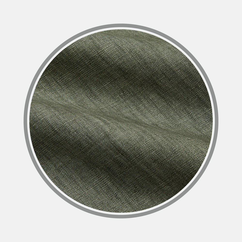 Close-up of Turnbull & Asser’s Sage Green Plain Linen Fabric, highlighting its fine diagonal weave within a circular frame on a white background.