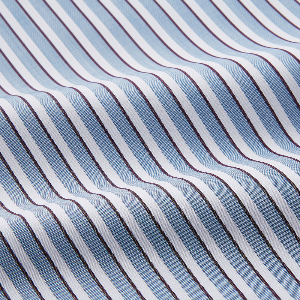 The Turnbull & Asser Blue and White Stripe Cotton Regular Fit Mayfair Shirt features long sleeves, a button-up front, collar, buttoned cuffs, and vertical stripes, shown on a white background.