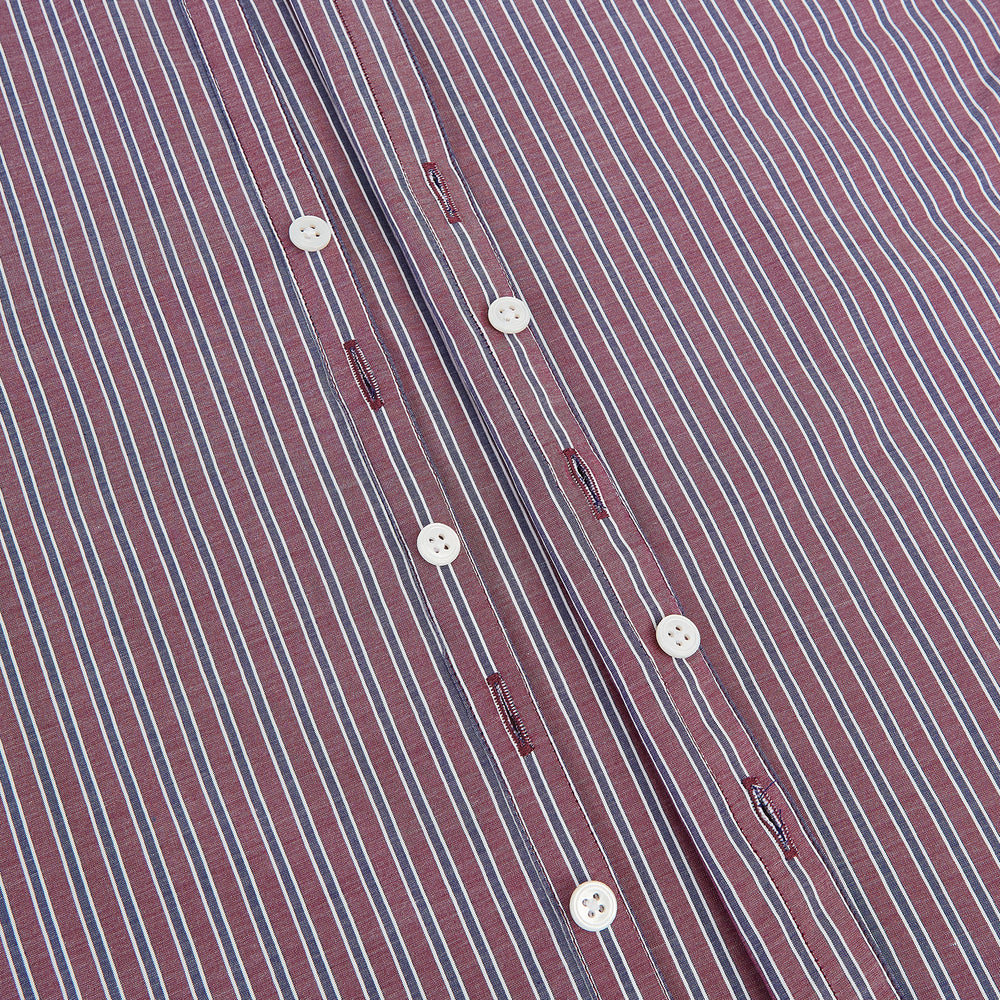 The Turnbull & Asser Wine Ticking Stripe Westminster Shirt features red, blue, and white vertical pinstripes on white and is shown laid flat on a white surface.