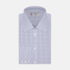 View 1 of product A neatly folded Turnbull & Asser Blue Grid Check Shirt features a T&A collar, 3-button cuffs, white buttons, and subtle British style. The blue and white check cotton design displays the brand label inside the collar.