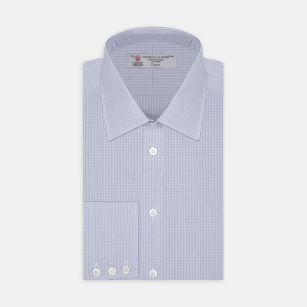 A neatly folded Turnbull & Asser Blue Grid Check Shirt features a T&A collar, 3-button cuffs, white buttons, and subtle British style. The blue and white check cotton design displays the brand label inside the collar.