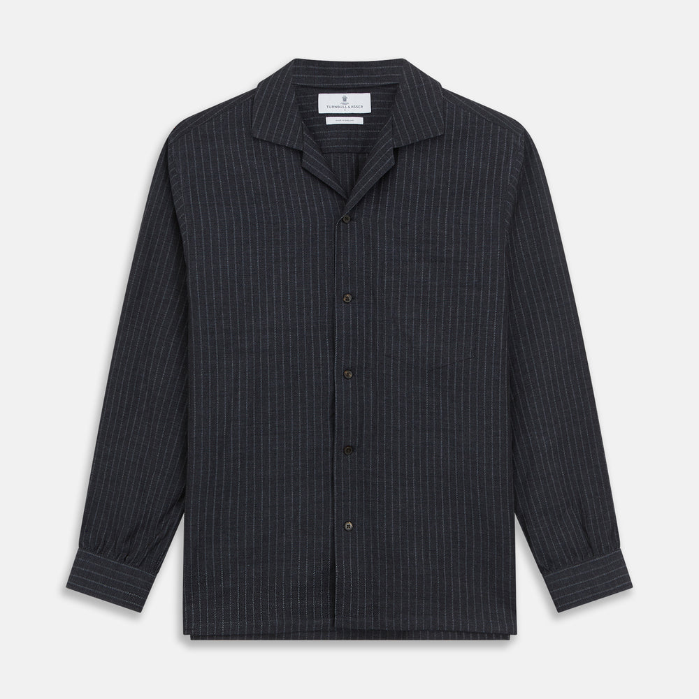 The Navy Tailored Pinstriped Shirt Jacket by Turnbull & Asser is a smart-casual, lightweight cotton-linen piece with long sleeves, a collar, left chest pocket, and front buttons for easy style.