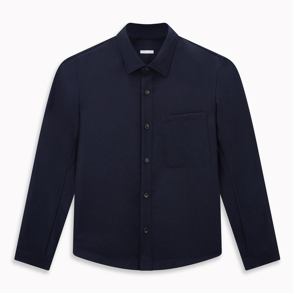 The Turnbull & Asser Midnight Blue Highbury Overshirt, featuring long sleeves, a collar, and a single chest pocket, is shown laid flat against a white background.