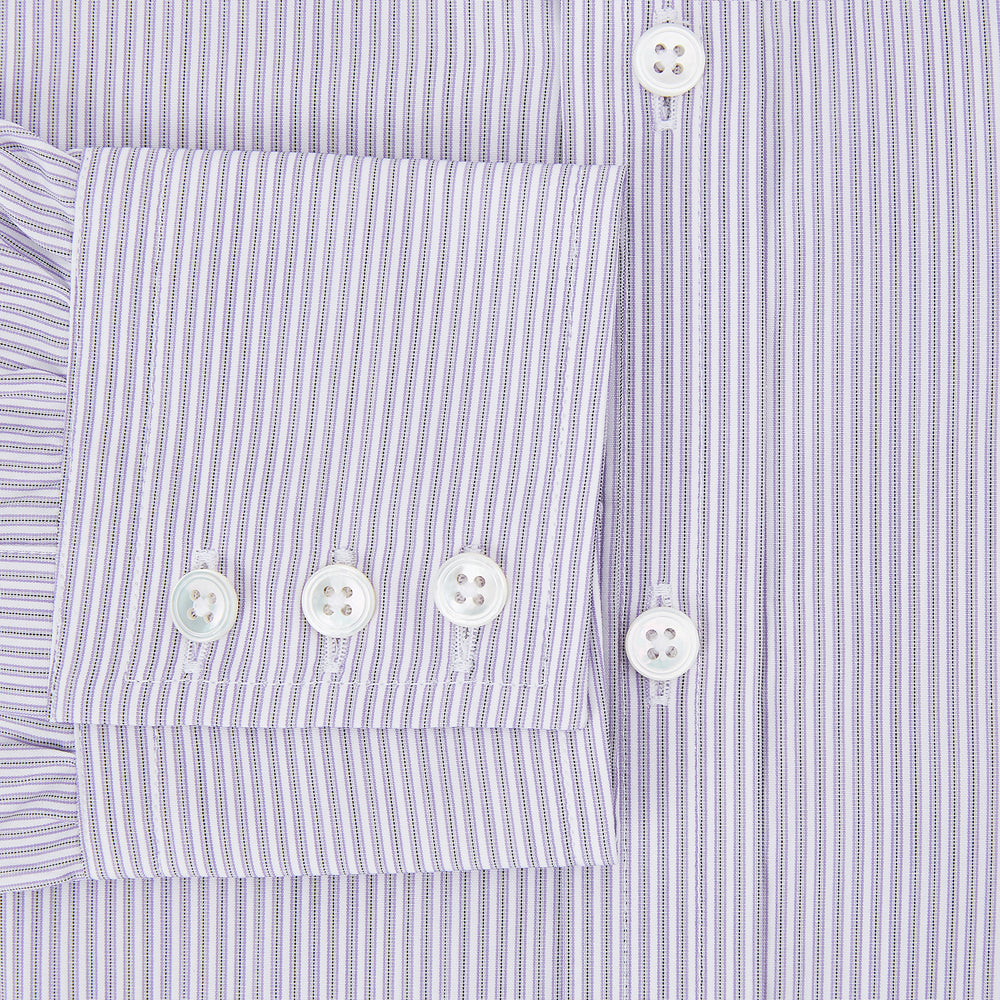 The Lilac Halo Stripe Mayfair Shirt by Turnbull & Asser features a relaxed Mayfair fit, white buttons, a pointed collar, and a subtle lilac stripe pattern for timeless sophistication.