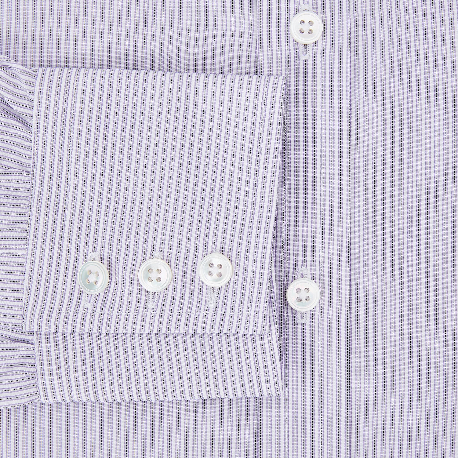 View 4 of product The Lilac Halo Stripe Mayfair Shirt by Turnbull & Asser features a relaxed Mayfair fit, white buttons, a pointed collar, and a subtle lilac stripe pattern for timeless sophistication.