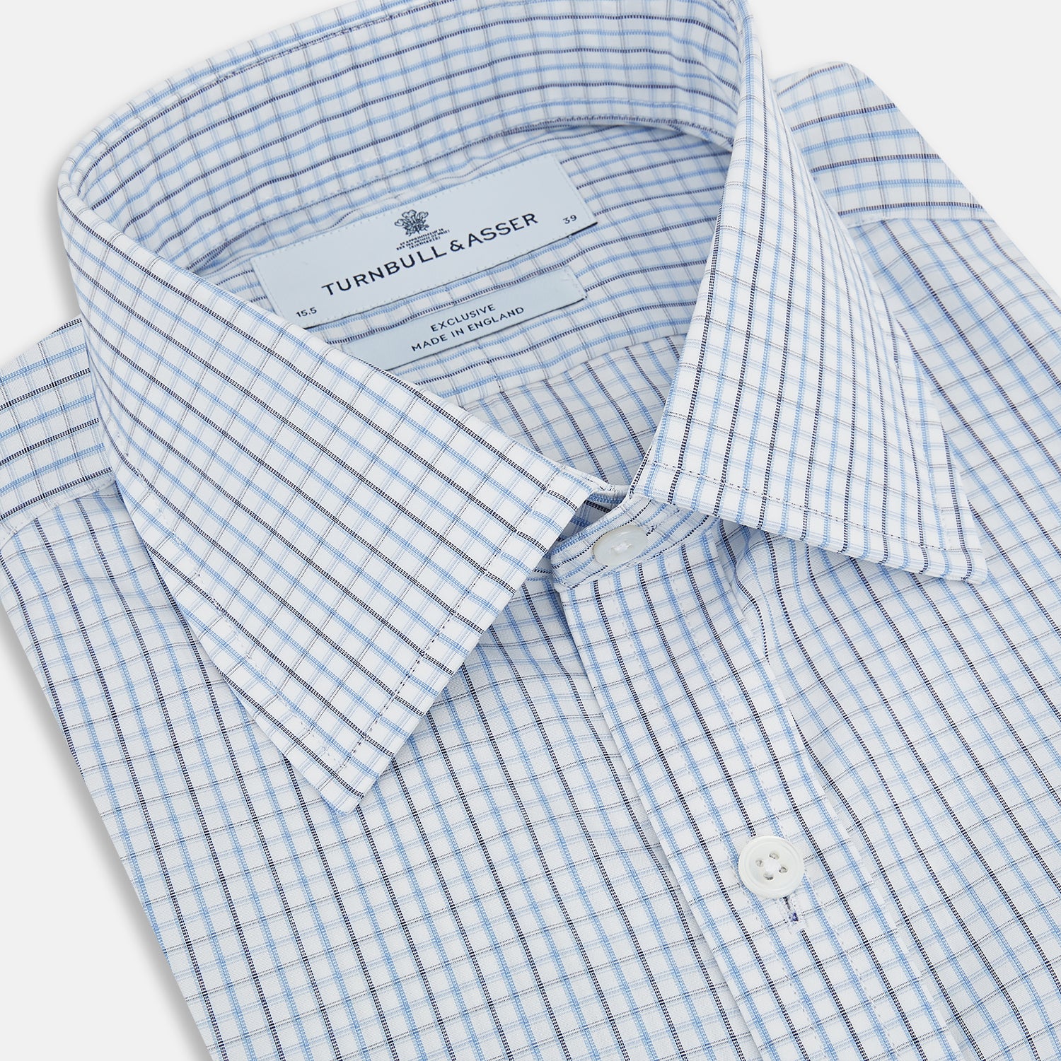 View 2 of product The Turnbull & Asser Navy and Blue Multi Check Mayfair Shirt features a T&A collar, button cuffs, and a blue checkered pattern. This long-sleeve, button-up shirt is shown on a white background.