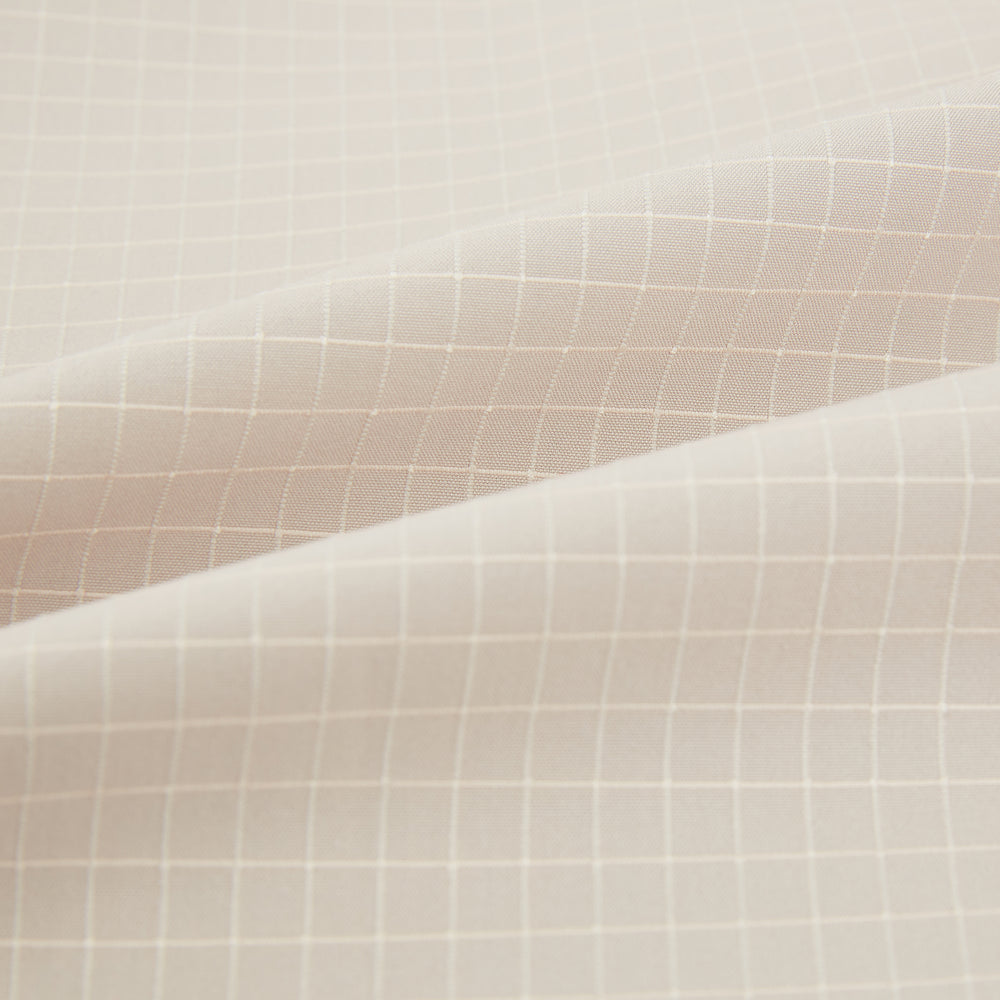 The Turnbull & Asser Pale Pink Fine Check Mayfair Shirt features long sleeves, a collared neckline, buttoned cuffs, and a subtle check pattern in sanforised cotton, displayed against a white background.