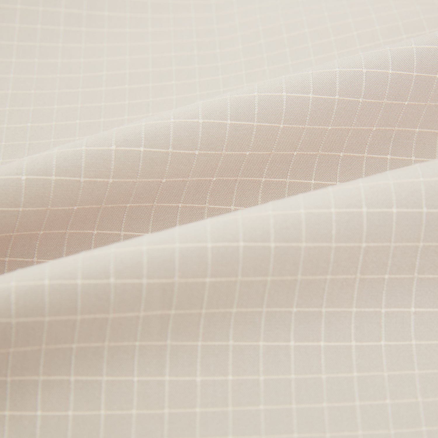 View 6 of product The Turnbull & Asser Pale Pink Fine Check Mayfair Shirt features long sleeves, a collared neckline, buttoned cuffs, and a subtle check pattern in sanforised cotton, displayed against a white background.