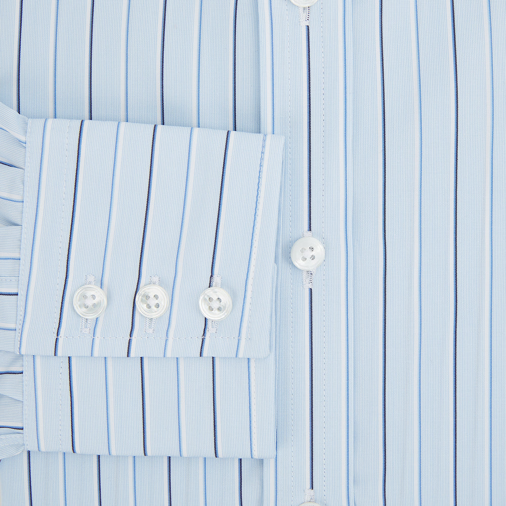 The Turnbull & Asser Navy and Blue Combination Stripe Mayfair Shirt, featuring thin vertical stripes and a classic collar, is displayed laid flat on a white background.