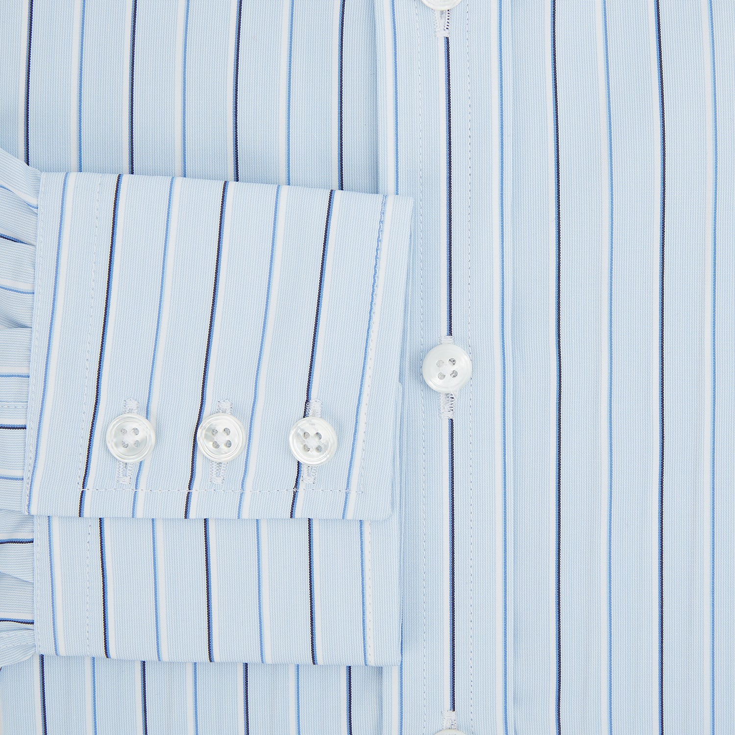 View 4 of product The Turnbull & Asser Navy and Blue Combination Stripe Mayfair Shirt, featuring thin vertical stripes and a classic collar, is displayed laid flat on a white background.