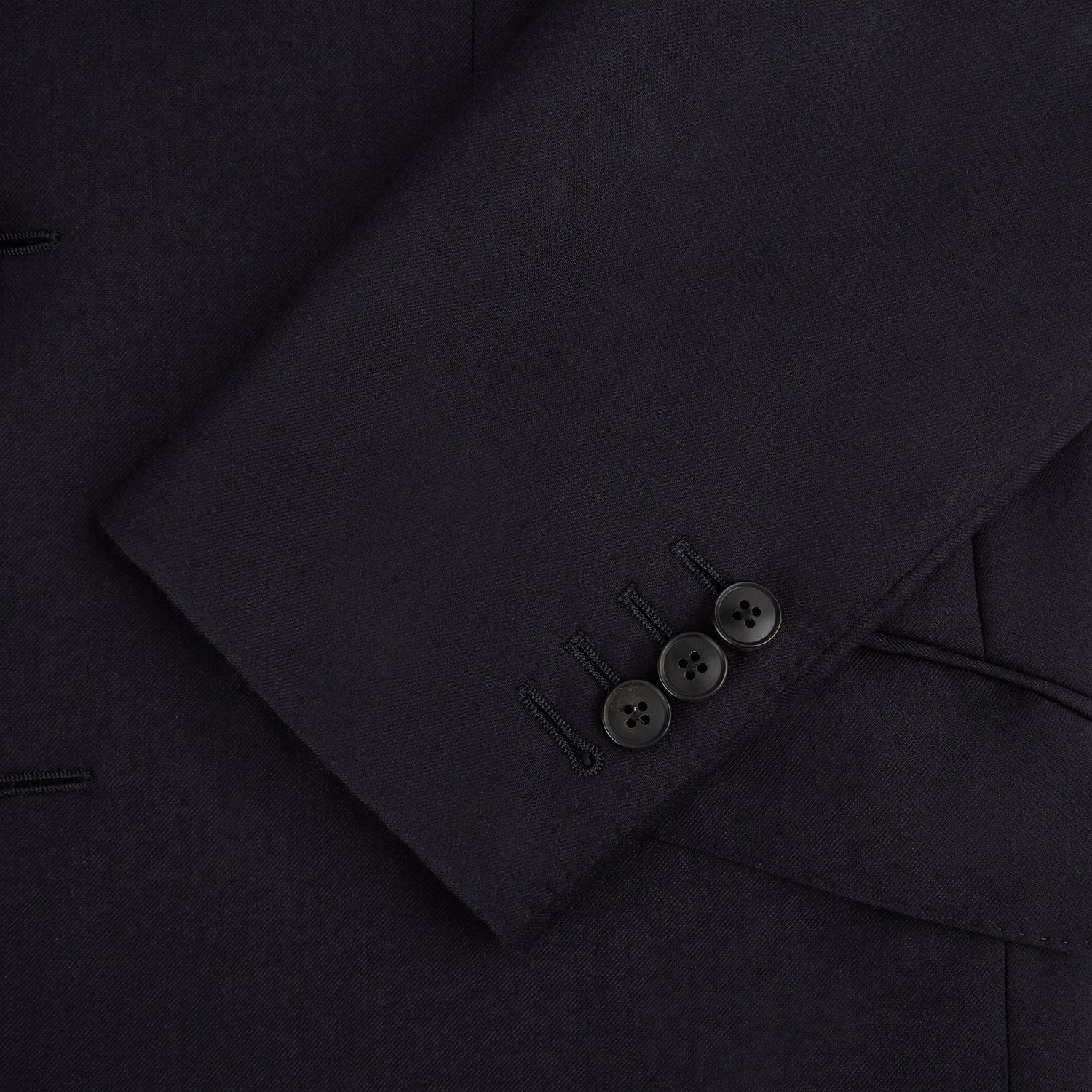 View 7 of product The Turnbull & Asser Navy Single Breasted Suit, consisting of a blazer and matching trousers, is neatly displayed on a white background—a timeless option for formal occasions.