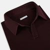 View 2 of product The Turnbull & Asser Burgundy Rugby Polo Shirt is a long-sleeve, pure cotton collared top with no visible buttons, shown laid flat on a white background.