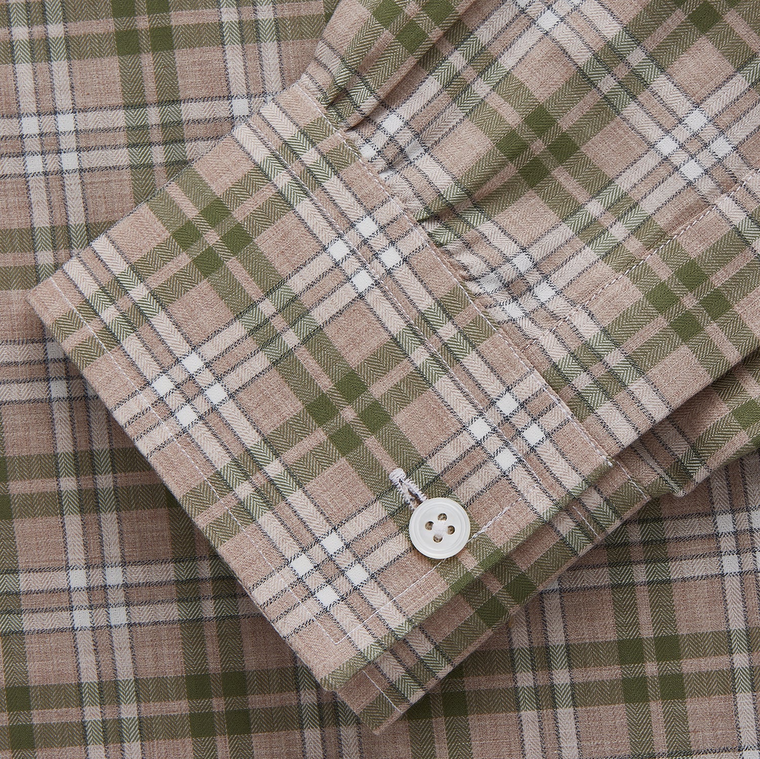 View 3 of product The Turnbull & Asser Green and Oatmeal Multi Check Cotton Weekend Fit Hayne Shirt features a button-down collar and green, beige, and white plaid pattern, shown flat against a white background.