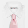 View 2 of product The Turnbull & Asser PINK PLAIN SATIN SILK TIE is neatly rolled and showcased against a plain white background.
