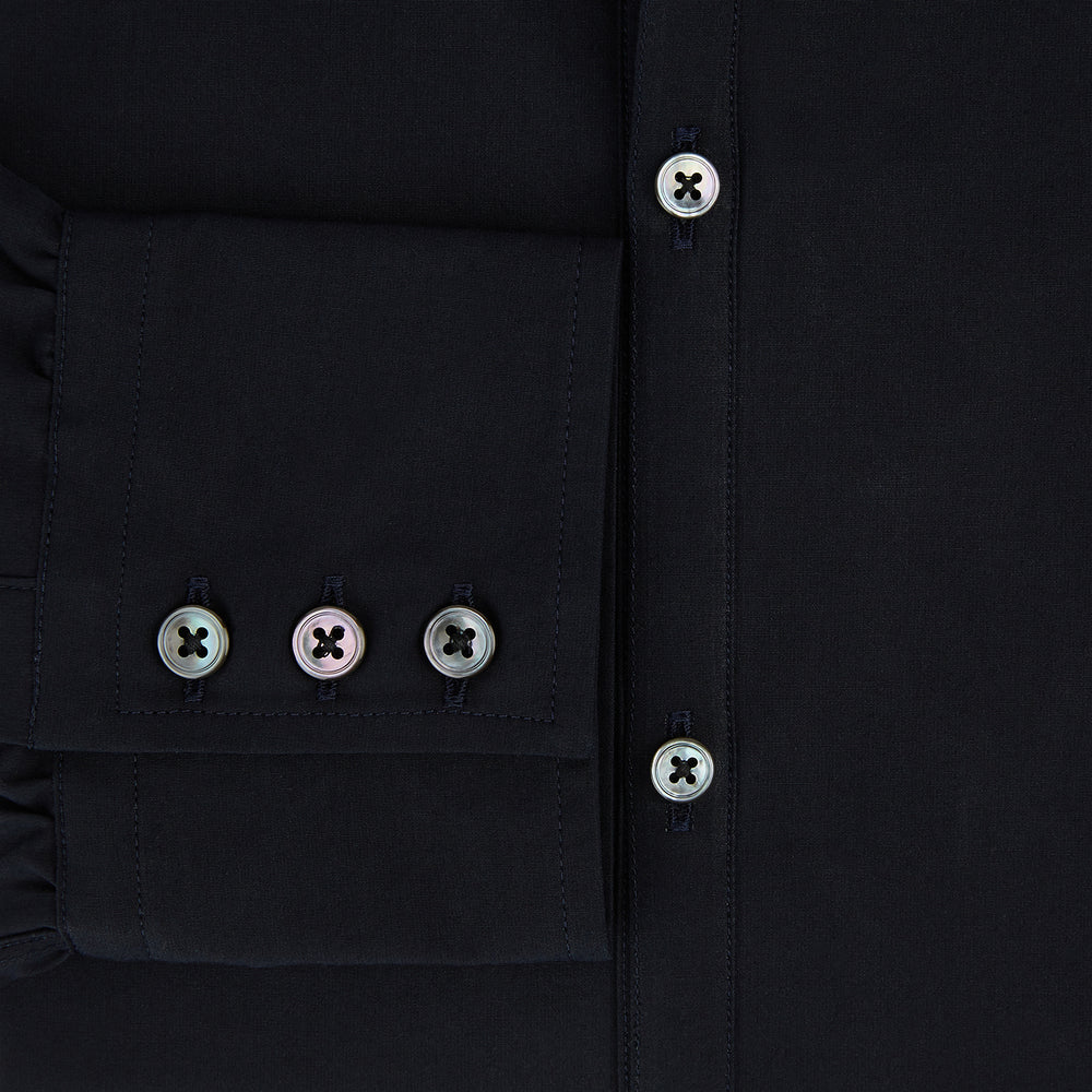 The DARK NAVY WINDSOR SHIRT by Turnbull & Asser is a long-sleeve shirt with a refined Windsor collar, showcasing classic British craftsmanship.