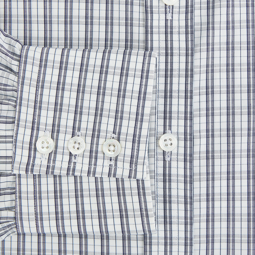 The Turnbull & Asser Navy Multi Check Mayfair Shirt is made from pure cotton with a blue and white check pattern, long sleeves, pointed collar, and buttoned cuffs, shown against a white background.