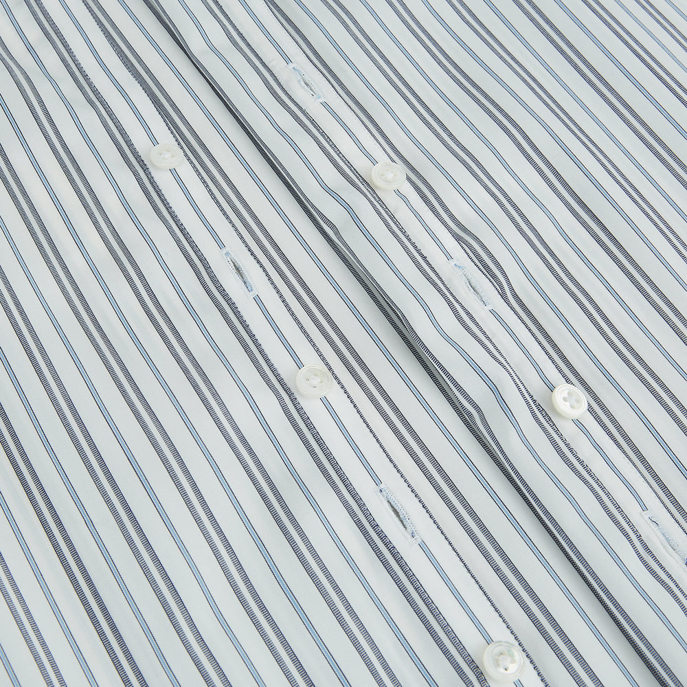 The Turnbull & Asser Navy and Light Blue Multi Track Stripe Westminster Shirt, featuring a button-up design with long sleeves and a signature collar, is displayed flat to highlight its expert British craftsmanship.