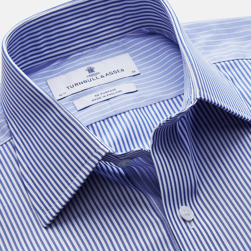 The Turnbull & Asser Blue and White Stripe Cotton RE-PURPOSE Mayfair Shirt, made with recycled fabrics, features long sleeves and a classic collar, and is shown flat against a white background.