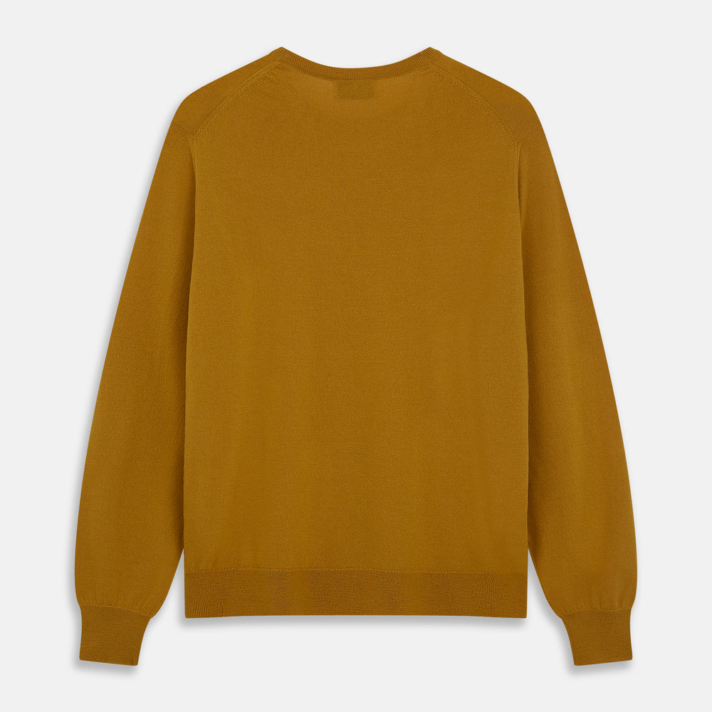 The Turnbull & Asser Gold Crew Neck Merino Jumper, featuring long sleeves and ribbed cuffs and hem, is displayed flat on a white background.