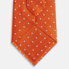 View 3 of product The Turnbull & Asser Orange and White Micro Dot Silk Tie features a subtle herringbone weave with small white dots—an elegant, modern accessory for the office.