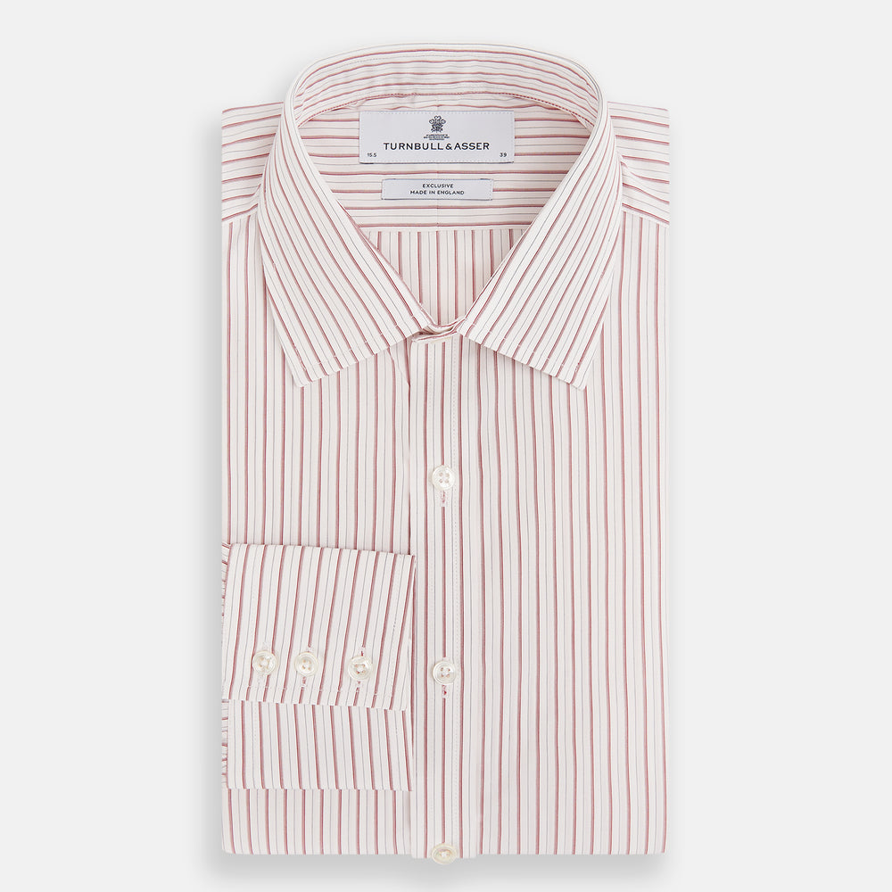 The Red Multi Ticking Stripe Mayfair Shirt by Turnbull & Asser features thin red and blue vertical stripes on white, a T&A collar, long sleeves, and button-up design.