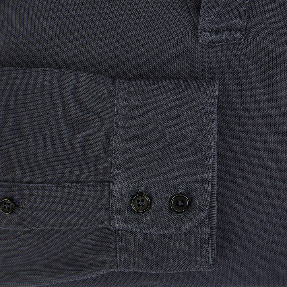 The Charcoal Rugby Polo Shirt by Turnbull & Asser is a pure cotton, long-sleeve polo in charcoal grey, featuring a collared open V-neck with no buttons, displayed flat on a white background.