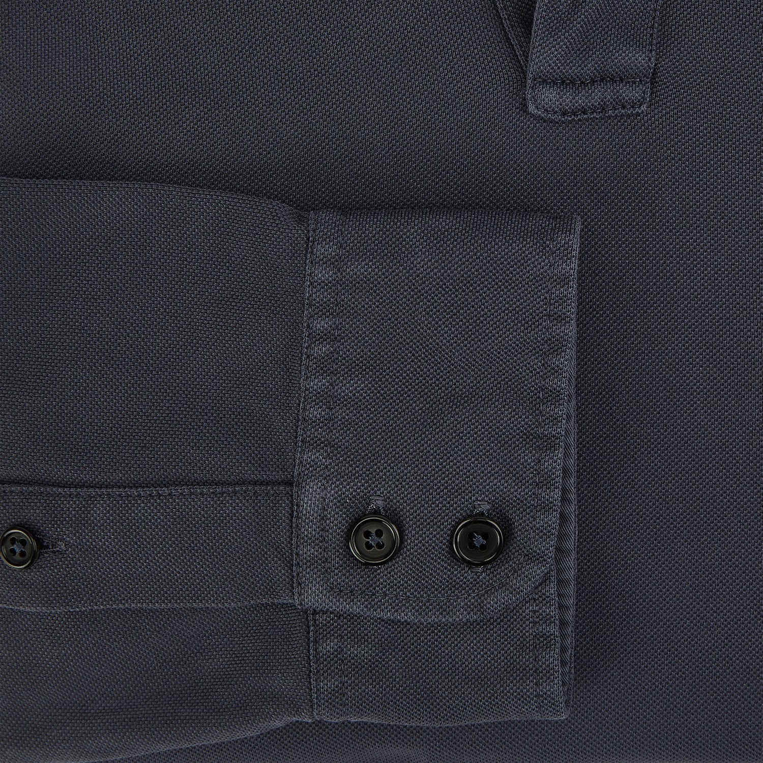 View 4 of product The Charcoal Rugby Polo Shirt by Turnbull & Asser is a pure cotton, long-sleeve polo in charcoal grey, featuring a collared open V-neck with no buttons, displayed flat on a white background.