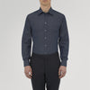 View 2 of product A neatly folded Turnbull & Asser Dark Blue Denim-Cashmere Shirt with a T&A collar and double cuffs, featuring black buttons, shown on a white background. The label inside the collar highlights its smart finish and refined style.