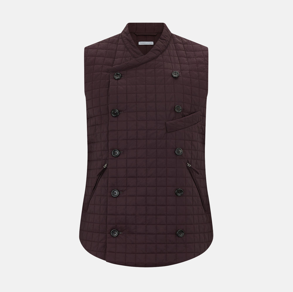 The Turnbull & Asser Burgundy Double-Breasted Quilted Gilet is a sleeveless vest with black buttons, an angled front, subtle check pattern, side and chest pockets—an ideal menswear piece for versatile layering.