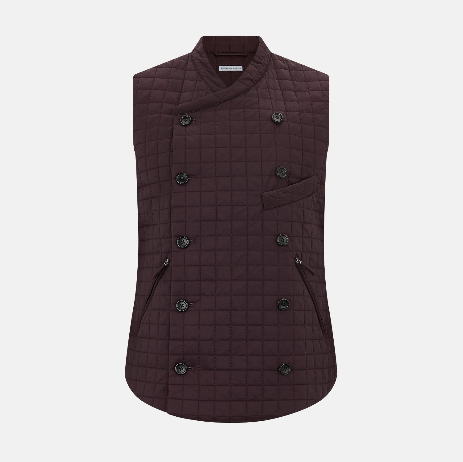 View 1 of product The Turnbull & Asser Burgundy Double-Breasted Quilted Gilet is a sleeveless vest with black buttons, an angled front, subtle check pattern, side and chest pockets—an ideal menswear piece for versatile layering.