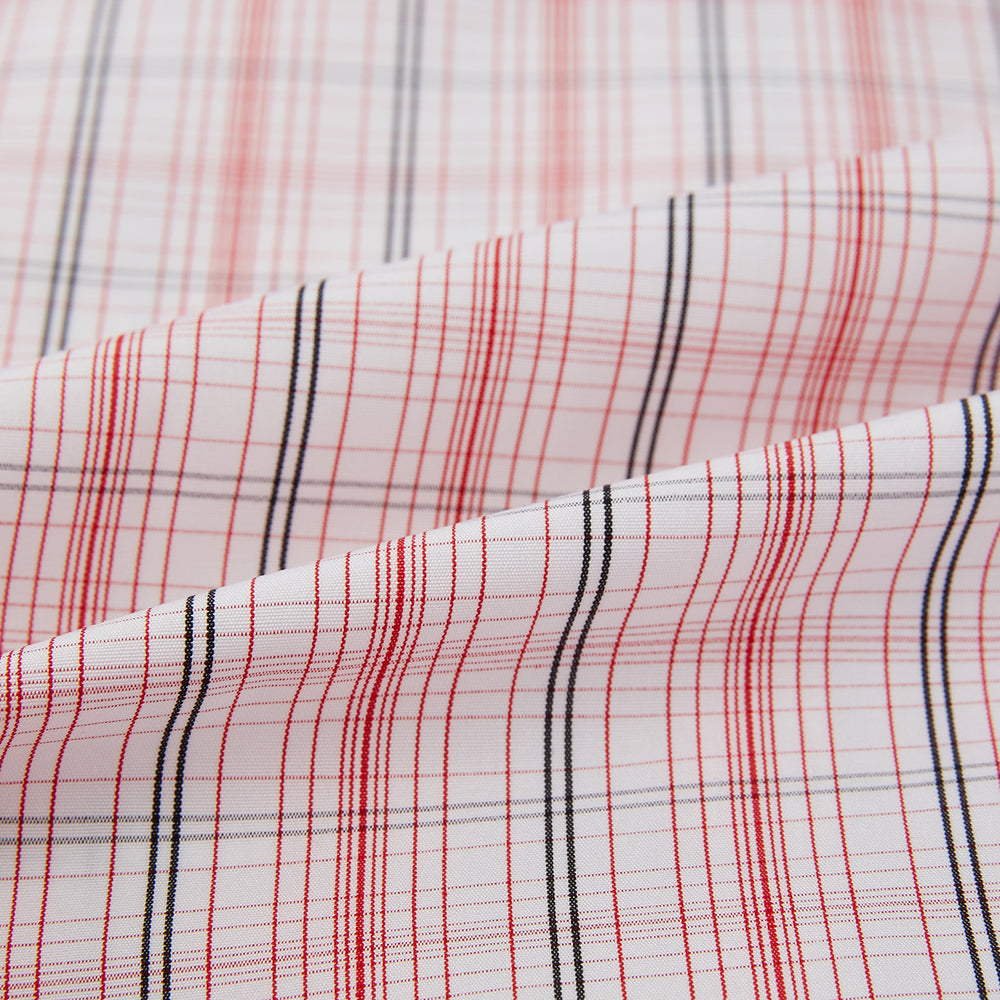 The Turnbull & Asser Red Multi Check Mayfair Shirt is a long-sleeve, button-up with a collar, crafted from Italian cotton and featuring a red multi check plaid pattern on white, shown laid flat against a white surface.