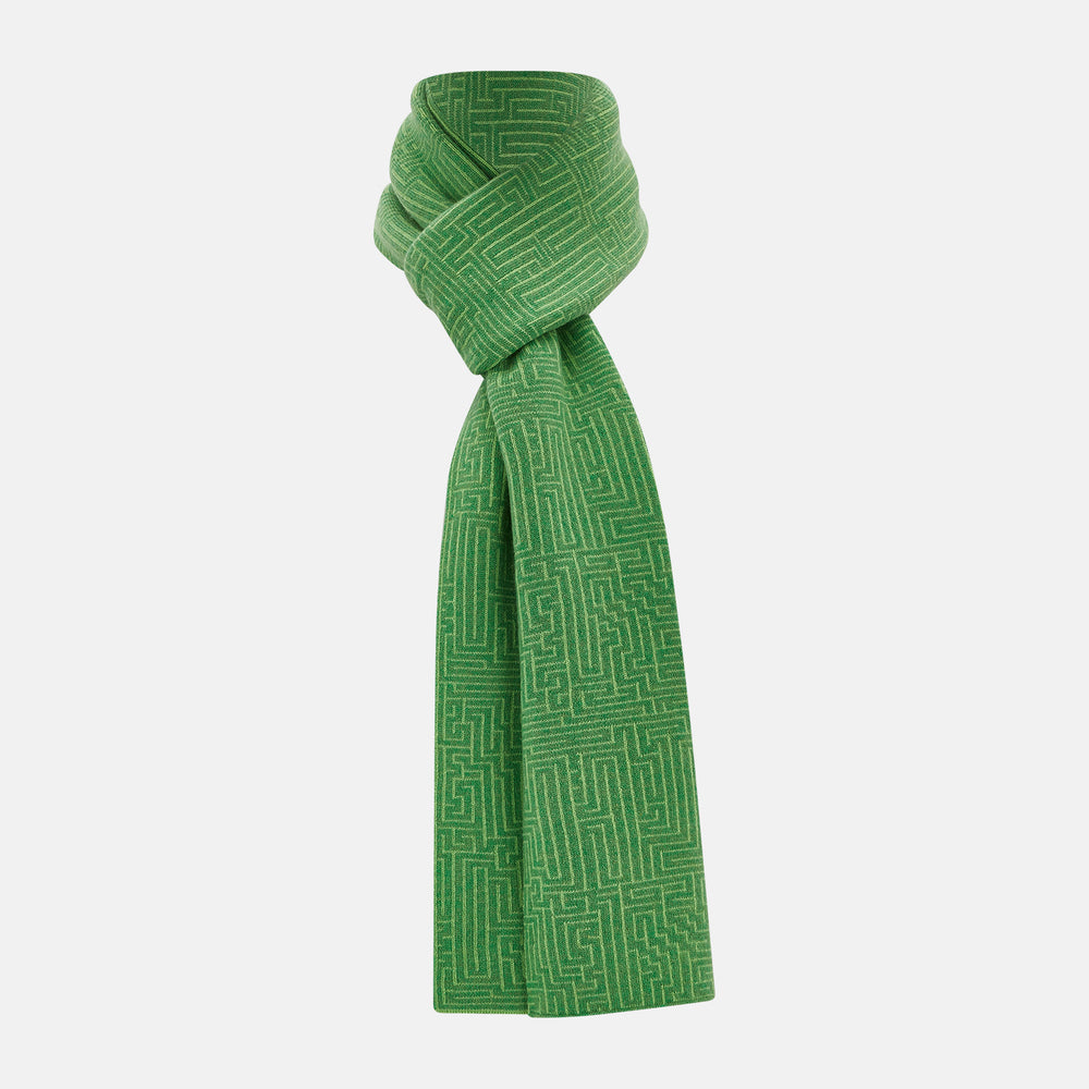 The Turnbull & Asser Kelly Green Fretwork Cashmere Knitted Scarf features a subtle, intricate pattern and is neatly knotted against a plain white background—an elegant accessory for any occasion.