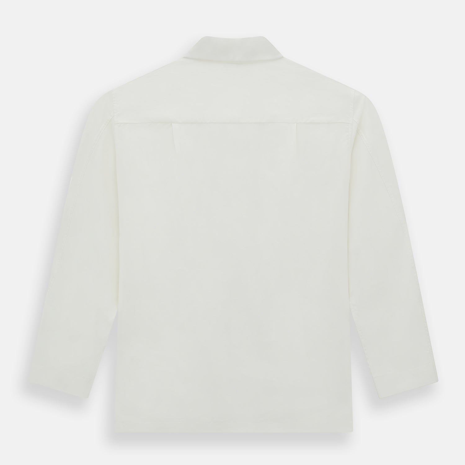 View 5 of product The Turnbull & Asser Cream Silk Pyjama Set, shown laid flat on a white background, features a long-sleeve button-up top with a chest pocket and matching pants with an elastic drawstring waist—ideal for comfortable loungewear.