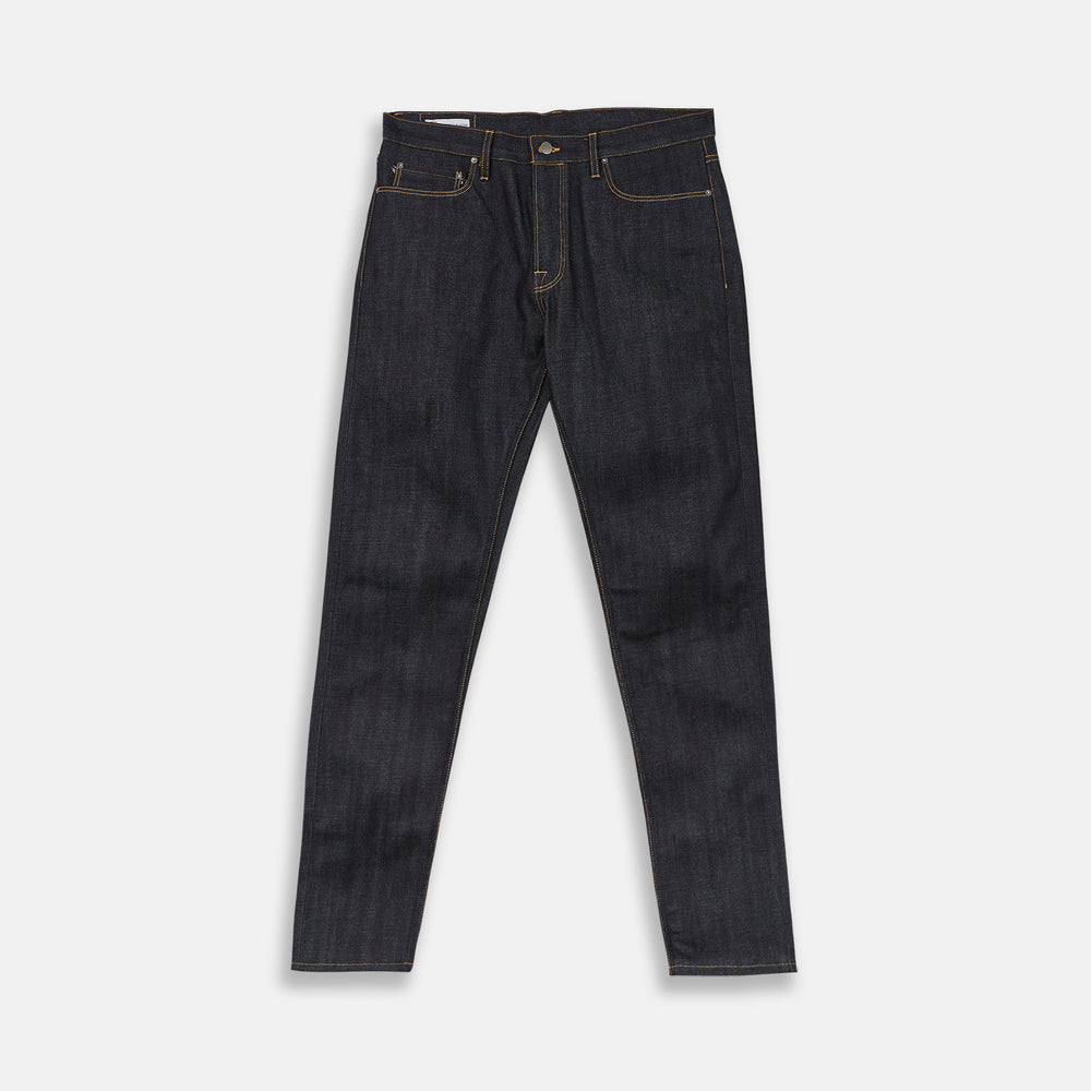 A pair of Turnbull & Asser Indigo Japanese Selvedge Denim Jeans in dark blue with rolled-up cuffs, yellow stitching, five pockets, and a button fly, laid flat on a white background.