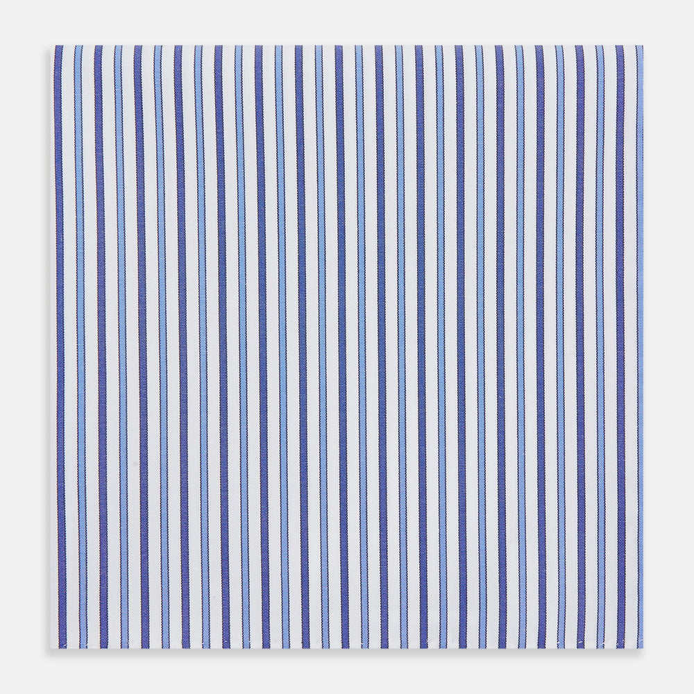 The Turnbull & Asser Navy and Blue Multi Stripe Handkerchief features a classic cotton pinstripe pattern—vertical blue and white stripes—making it a versatile and elegant formal accessory.