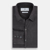 View 5 of product The Ash Linen Windsor Shirt by Turnbull & Asser is a long-sleeve, button-up black shirt with a Windsor collar and cuffs, reflecting British craftsmanship, shown on a plain white background.