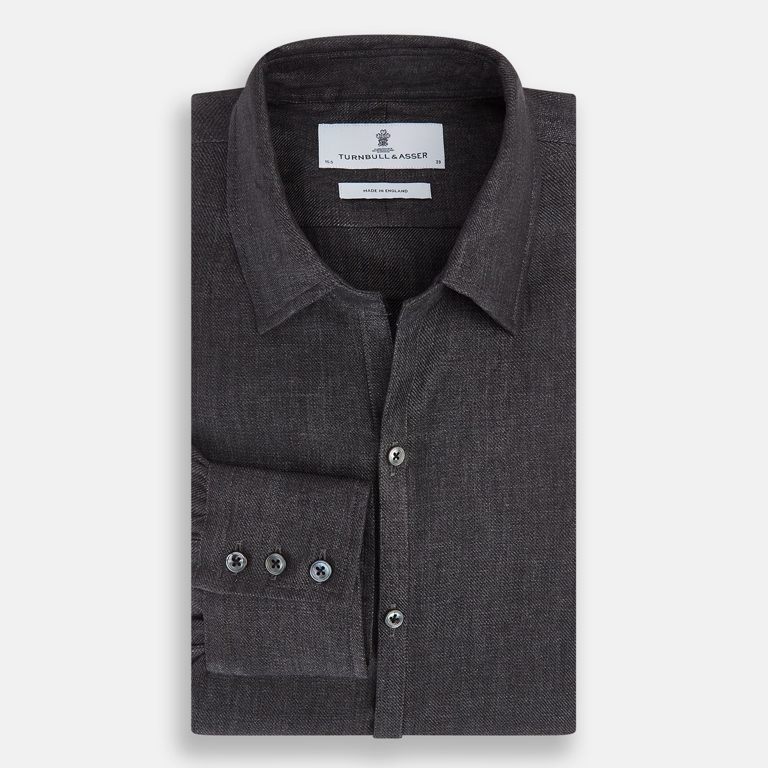 View 5 of product The Ash Linen Windsor Shirt by Turnbull & Asser is a long-sleeve, button-up black shirt with a Windsor collar and cuffs, reflecting British craftsmanship, shown on a plain white background.