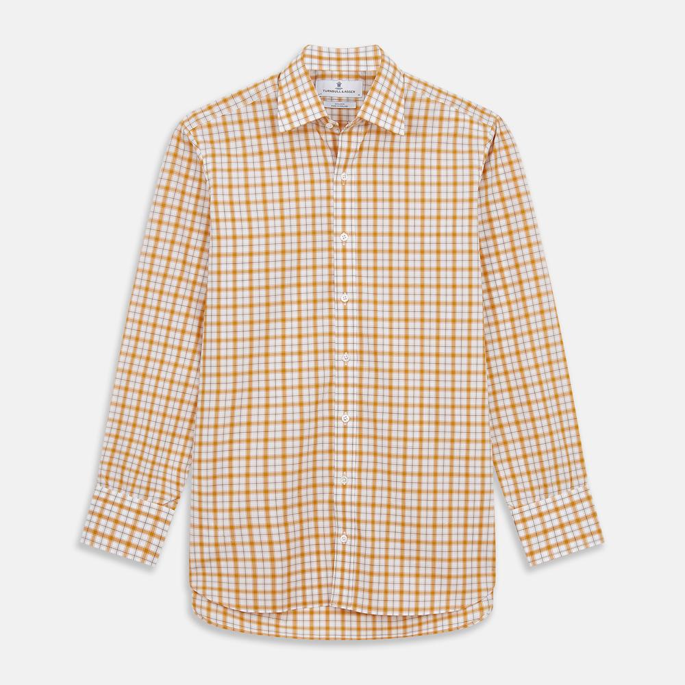 Close-up of Turnbull & Asser’s Orange Multi Check Cotton Fabric, featuring a yellow and white plaid with black and gray lines. Shown within a circular frame on light gray, the material looks soft with slight wrinkles.