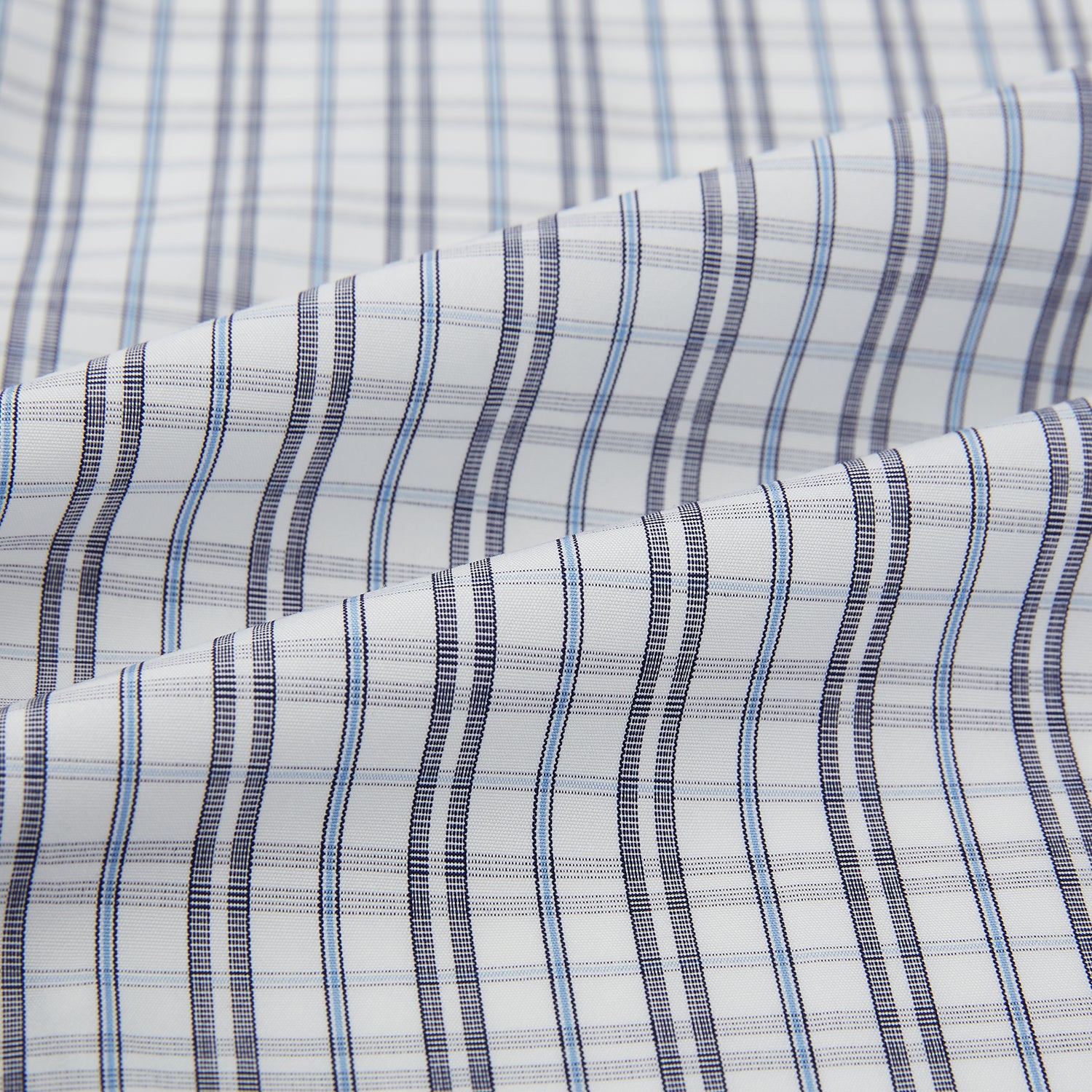 View 8 of product The Turnbull & Asser Navy and Blue Multi Tattersall Westminster Shirt features long sleeves, a button-down style, and a Turnbull collar in a blue and gray check pattern on white, laid flat against a white background.