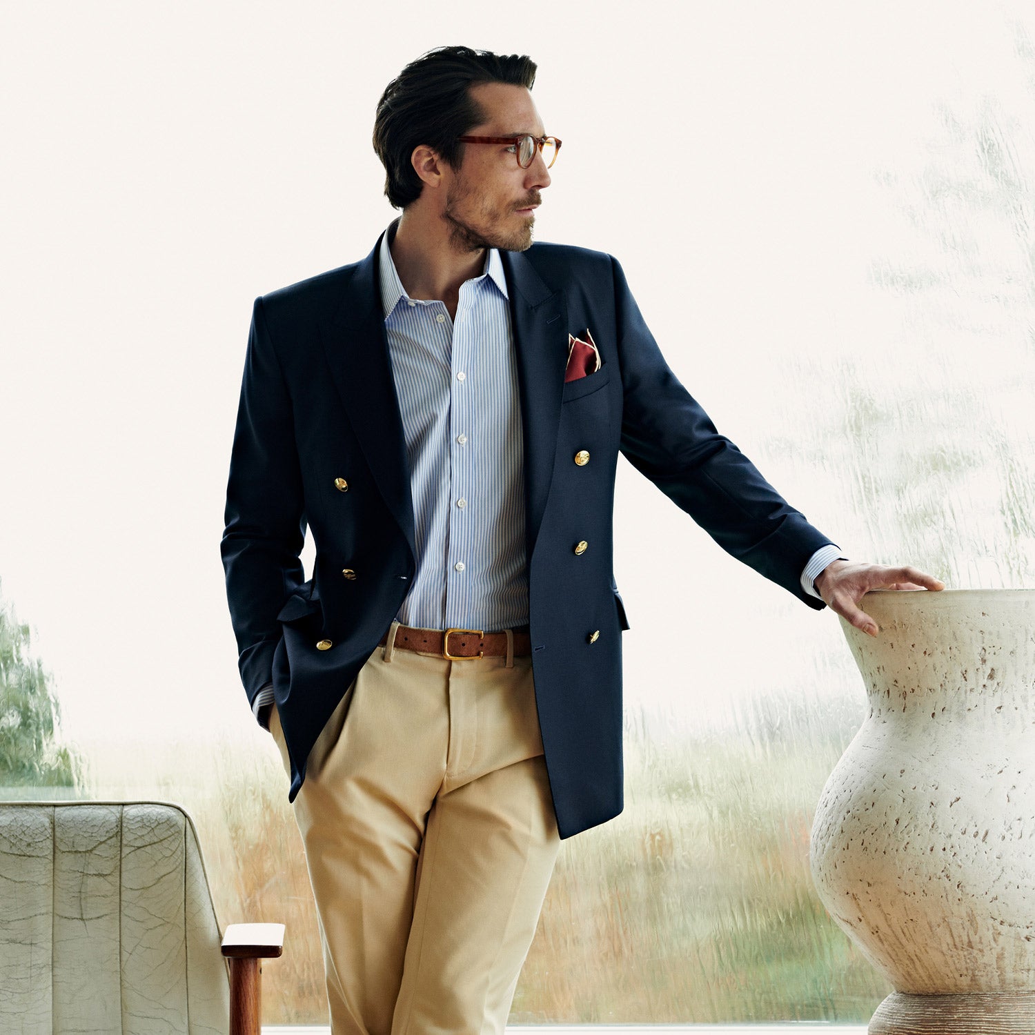 View 5 of product The Classic Navy Wool Blazer by Turnbull & Asser features a double-breasted design, gold buttons, notched lapels, and multiple front pockets, shown on a white background. This piece offers timeless, sophisticated nautical style.