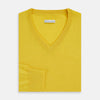 View 4 of product The Turnbull & Asser Canary Yellow Fine Merino V-Neck Jumper, crafted from soft knitwear, features long sleeves and is displayed on a white background.