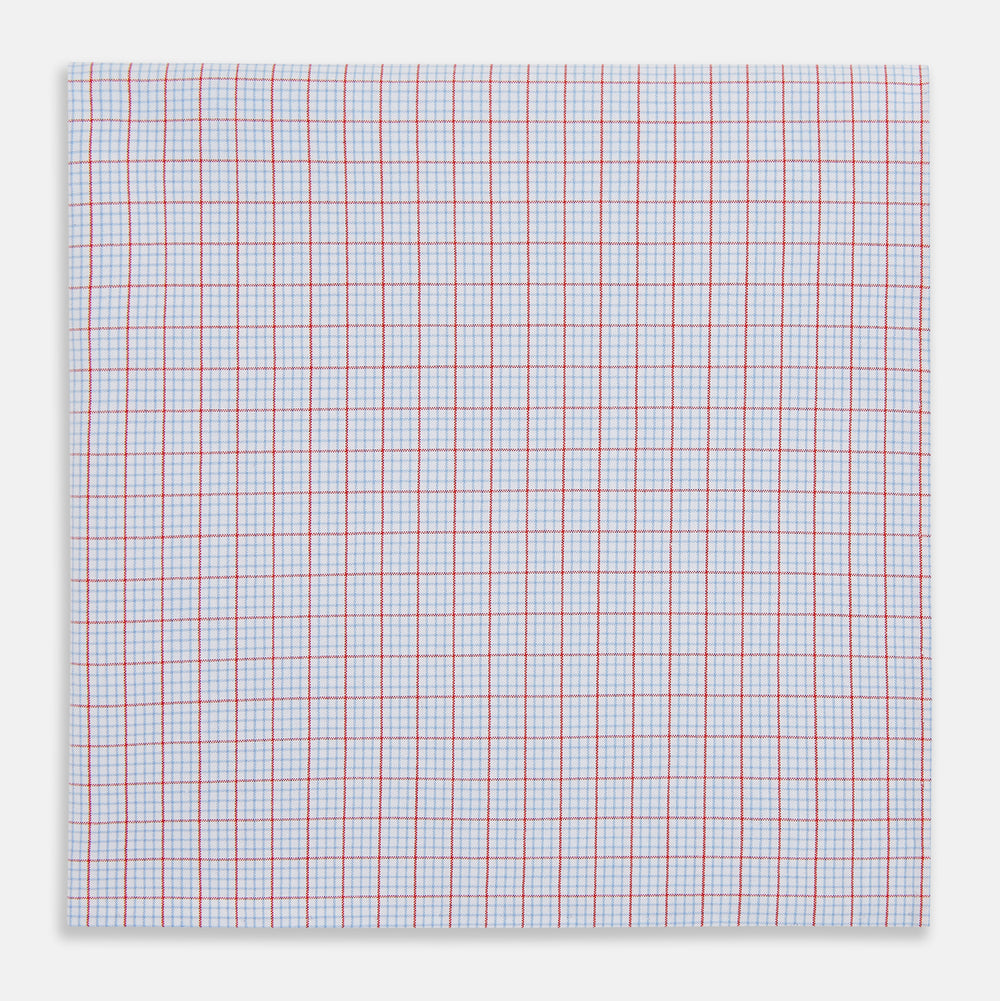 The Turnbull & Asser Hand Rolled Red Multi Graph Check Handkerchief features blue and red grid lines on white, with a red check forming larger squares and blue lines creating smaller squares within the design.